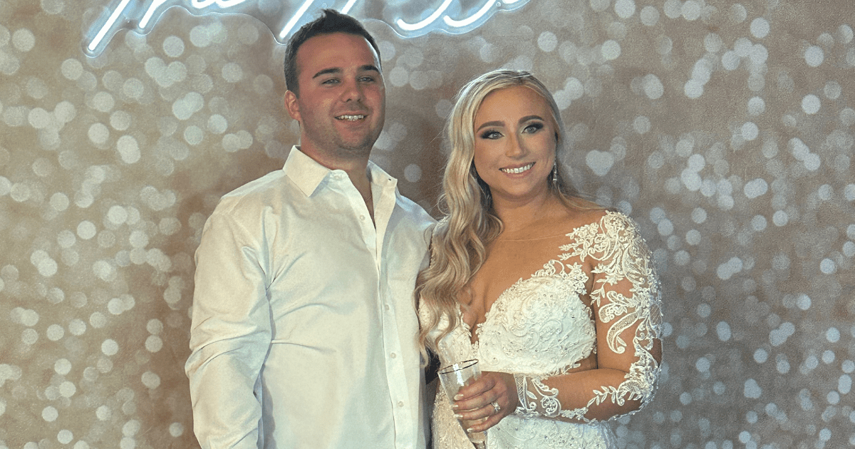 bride and groom using wedding photo booth Augusta