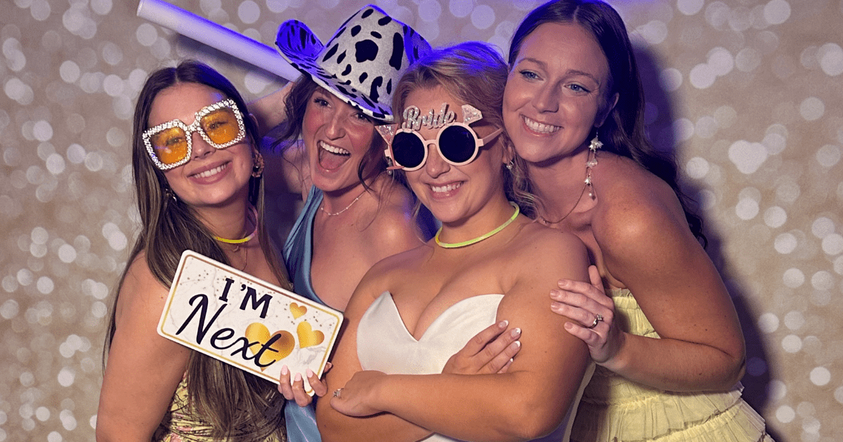 Bride and friends using luxury photo booth at wedding in Augusta GA